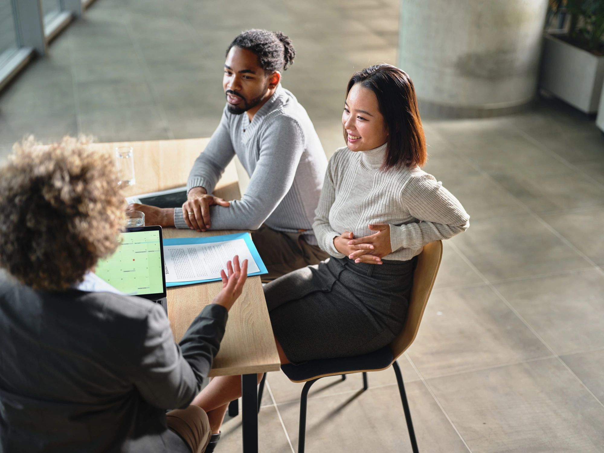 Couple meeting with a professional advisor in an office
