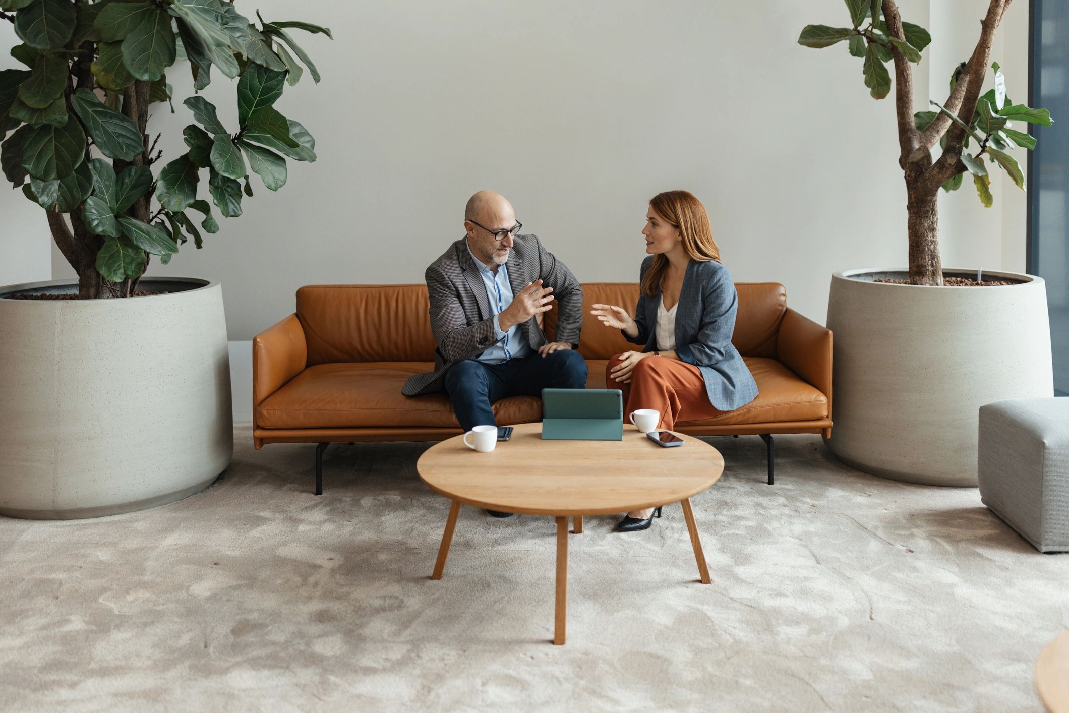 Two adults reviewing information during a consultation